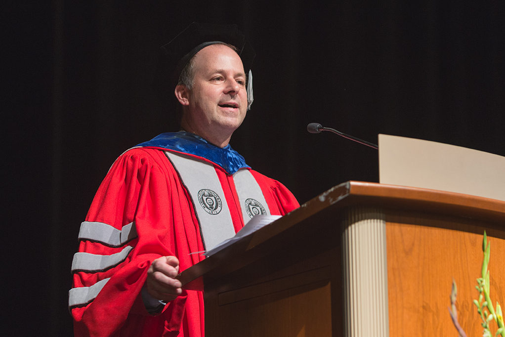 2018 UW-Madison School of Pharmacy Hooding Ceremony Dave Zgarrick speaking at podium