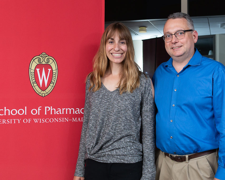 sop092719_011 Anne Turco, scholarship recipient, with professor Paul Marker next to School of Pharmacy banner