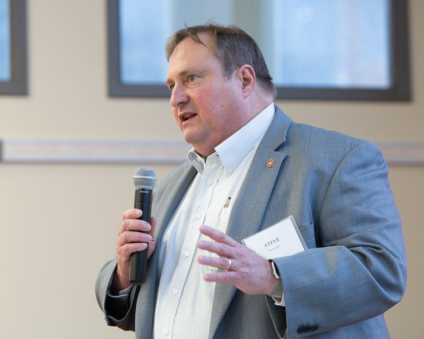 sop092719_057 Steve Swanson speaking into microphone at event